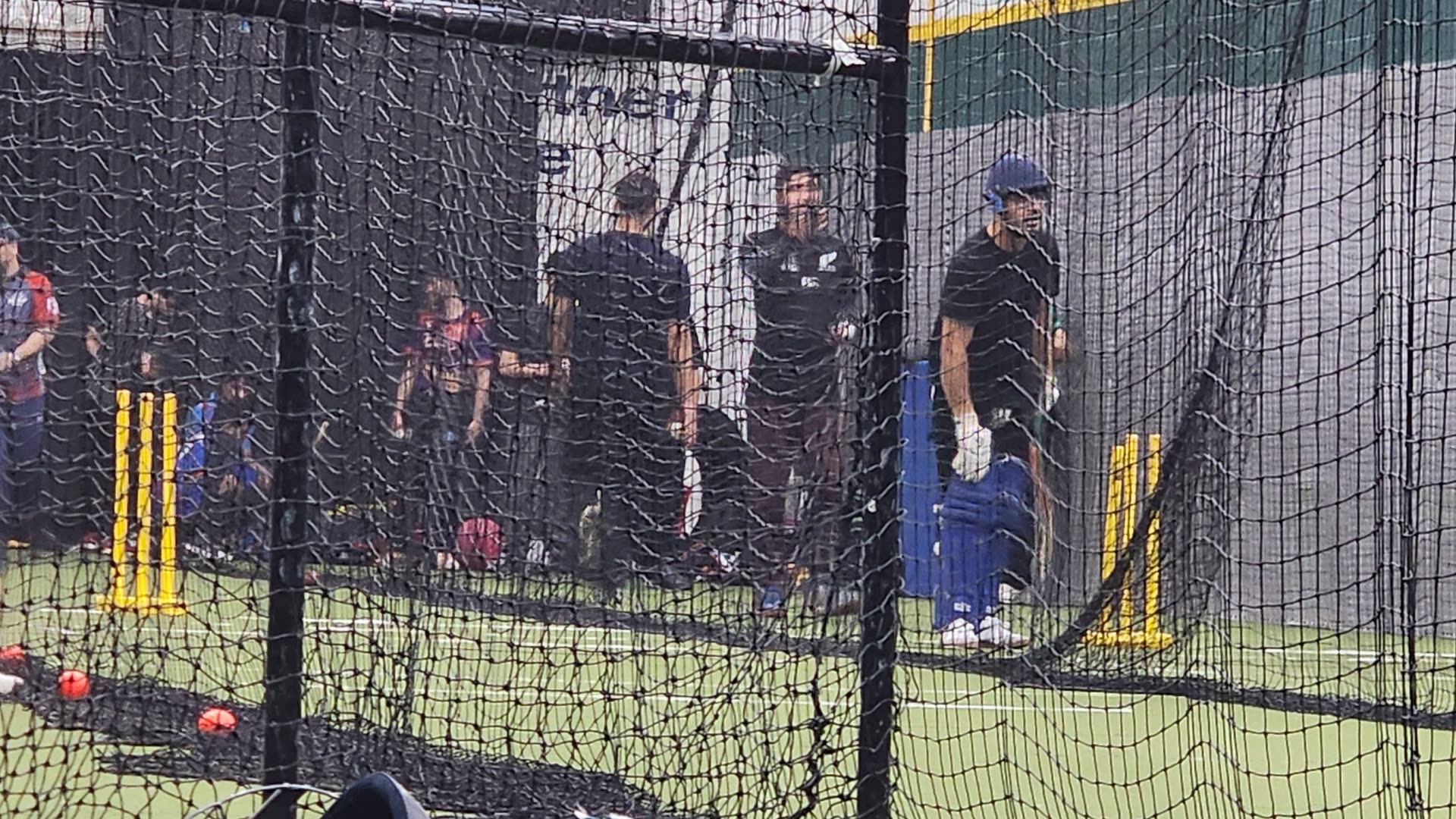 Intermediate youth cricketers training in the nets with a coach at Revolution Cricket Academy